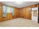 This bedroom features warm wood paneled walls, and access to an adjacent room at 16632 Oak Rd, Westfield, IN 46074