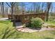 Exterior view of the home features mature trees, a patio and a lush lawn at 16632 Oak Rd, Westfield, IN 46074
