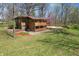 A spacious backyard with flourishing flower beds and mature trees at 16632 Oak Rd, Westfield, IN 46074