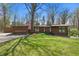 Charming single-story home with attached garage, nestled on a lush green lawn with beautiful flowering trees at 16632 Oak Rd, Westfield, IN 46074