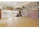 Bright garage featuring built-in shelving units for ample storage space at 16632 Oak Rd, Westfield, IN 46074