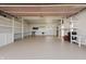 Spacious garage with storage and shelving perfect for any hobbyist or car enthusiast at 16632 Oak Rd, Westfield, IN 46074
