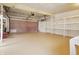 Spacious garage features shelving and an automatic door at 16632 Oak Rd, Westfield, IN 46074