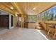 Relaxing hot tub room featuring wood walls, ceiling, tile floors and view to the outside at 16632 Oak Rd, Westfield, IN 46074