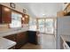 Kitchen featuring wood cabinets, white countertops, and multiple windows at 16632 Oak Rd, Westfield, IN 46074