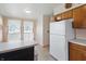 Functional kitchen featuring a white refrigerator and an adjacent breakfast nook with lots of natural light at 16632 Oak Rd, Westfield, IN 46074