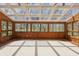 Sunroom featuring wood paneling and views of the surrounding trees at 16632 Oak Rd, Westfield, IN 46074