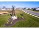 Windmill feature in a Silo Ridge community with landscaped flower beds and expansive green space at 17039 Silo Ridge Way, Noblesville, IN 46060