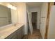 Unfinished bathroom featuring a double sink vanity with a large mirror, plus door openings at 17039 Silo Ridge Way, Noblesville, IN 46060
