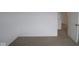 This bedroom features neutral carpeting with a conveniently placed light switch and doorway access at 17039 Silo Ridge Way, Noblesville, IN 46060