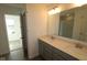 The bathroom features a double sink vanity, granite countertop, and large mirror, plus a glass-enclosed shower at 17062 Cowbell Dr, Noblesville, IN 46060