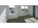 This bedroom has neutral carpet and many windows providing natural light at 17062 Cowbell Dr, Noblesville, IN 46060