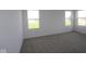 This bedroom has neutral carpet, multiple windows and fresh paint at 17062 Cowbell Dr, Noblesville, IN 46060