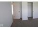 This bedroom has neutral carpet and a closet at 17062 Cowbell Dr, Noblesville, IN 46060