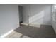 This bedroom has neutral carpet and a view of the outside at 17062 Cowbell Dr, Noblesville, IN 46060