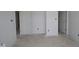 Bright, unfinished bedroom featuring white walls, white trim, and access to closets or other rooms at 17062 Cowbell Dr, Noblesville, IN 46060