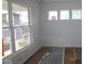 Bright living room with large windows offering ample natural light and white walls at 17062 Cowbell Dr, Noblesville, IN 46060
