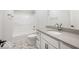 Clean bathroom featuring tile flooring, a white vanity, and a shower-tub combination at 19590 Wood Farm Pl, Westfield, IN 46074