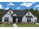 Charming two-story home featuring vertical siding, gray accents and a well-manicured lawn at 19590 Wood Farm Pl, Westfield, IN 46074
