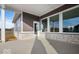 Covered back patio with stone accents and large windows, perfect for outdoor entertaining at 19590 Wood Farm Pl, Westfield, IN 46074