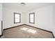 Bedroom with wall-to-wall carpet and two large windows at 2034 Mansfield St, Indianapolis, IN 46202