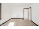 A bedroom with neutral carpet and an open closet at 2034 Mansfield St, Indianapolis, IN 46202