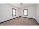 Bedroom with wall-to-wall carpet, white walls, and two windows at 2034 Mansfield St, Indianapolis, IN 46202