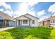 Charming home featuring a cozy front porch and well-manicured lawn at 2034 Mansfield St, Indianapolis, IN 46202