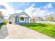 View of the charming exterior with white siding, and a driveway at 2034 Mansfield St, Indianapolis, IN 46202