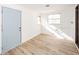 Laundry room with plank flooring, white walls, and a blue door at 2034 Mansfield St, Indianapolis, IN 46202