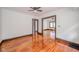 Spacious living room with polished hardwood floors and neutral paint at 2034 Mansfield St, Indianapolis, IN 46202