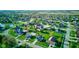 An aerial view of the homes in a residential community on a lush green landscape and a water feature at 2215 Golfside Dr, Lebanon, IN 46052