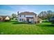 Expansive backyard featuring a lush lawn, patio area, and outdoor seating under a pergola at 2215 Golfside Dr, Lebanon, IN 46052