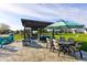 Backyard patio featuring a pergola, dining table, lounge seating, and stone accents at 2215 Golfside Dr, Lebanon, IN 46052