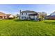 Large backyard with a pergola, patio, outdoor seating, and lush lawn at 2215 Golfside Dr, Lebanon, IN 46052