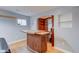 Basement bar area with custom wood bar and shelving, and a window at 2215 Golfside Dr, Lebanon, IN 46052