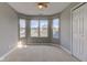 Bright bedroom featuring large bay window, neutral carpeting, ceiling fan, and closet for ample storage at 2215 Golfside Dr, Lebanon, IN 46052