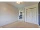 Bright bedroom featuring neutral carpet, white walls, closet, and access to the hallway, creating a modern space at 2215 Golfside Dr, Lebanon, IN 46052
