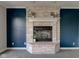 Close up of a white brick fireplace featuring mantle decor and a gas insert at 2215 Golfside Dr, Lebanon, IN 46052