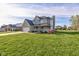 Beautifully designed two-story house with a lush green lawn and a brick facade at 2215 Golfside Dr, Lebanon, IN 46052