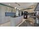 Kitchen boasts an island, stainless steel appliances and tile backsplash at 2215 Golfside Dr, Lebanon, IN 46052