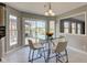 Eat-in kitchen area featuring sliding glass doors and modern light fixtures at 2215 Golfside Dr, Lebanon, IN 46052