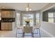 Kitchen nook featuring tile floors, modern lighting and outdoor views at 2215 Golfside Dr, Lebanon, IN 46052
