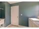 Laundry room with a white door and wall-mounted wire shelving at 2215 Golfside Dr, Lebanon, IN 46052