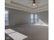 Spacious main bedroom featuring tray ceiling, neutral carpet, and lots of natural light at 2215 Golfside Dr, Lebanon, IN 46052