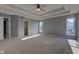 Carpeted main bedroom features neutral walls, a walk-in closet, and lots of sunlight at 2215 Golfside Dr, Lebanon, IN 46052