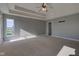 Bright, carpeted main bedroom with tray ceiling, walk-in closet, and lots of sunlight at 2215 Golfside Dr, Lebanon, IN 46052