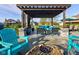 Beautiful outdoor patio with pergola, fire pit, comfortable seating, and an outdoor dining area at 2215 Golfside Dr, Lebanon, IN 46052