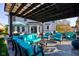 Covered patio with outdoor seating, pergola, and elegant design elements at 2215 Golfside Dr, Lebanon, IN 46052