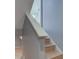 Up close view of a finished stairway featuring painted white trim and light hardwood steps at 2215 Golfside Dr, Lebanon, IN 46052